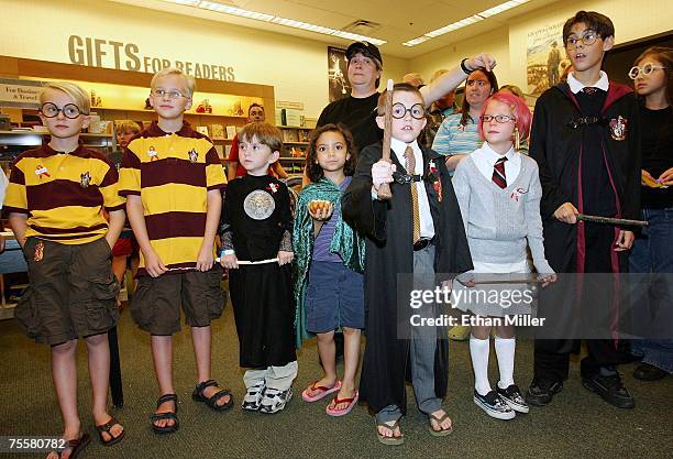 Harry Potter fans participate in a costume contest during a book release party for "Harry Potter and the Deathly Hallows" at a Barnes & Noble...