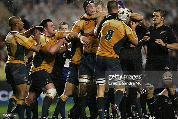 Dan Vickerman of the Wallabies and Keith Robinson o New Zealand push each other during the 2007 Tri Nations series match between New Zealand and...