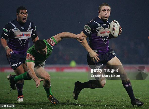 Ryan Hoffman of the Storm makes a line break during the round 19 NRL match between the Melbourne Storm and the Canberra Raiders at Olympic Park July...