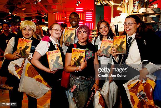 Harry Potter fans hold the new "Harry Potter and the Deathly Hallows" at Toys "R" Us, Times Square on July 20, 2007 in New York City.