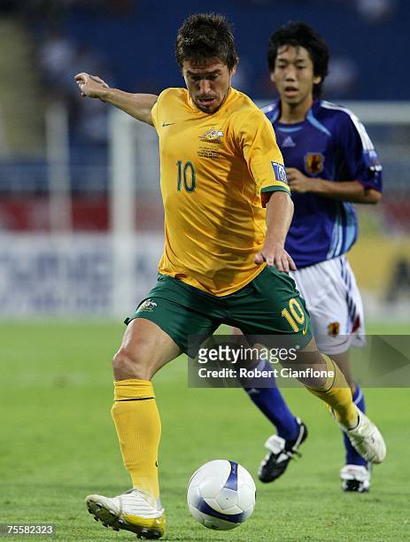 Harry Kewell of Australia kicks to move the ball forward during the AFC Asian Cup 2007 Quarter Final between Japan and the Australian Socceroos at My...