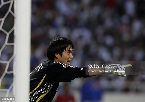 Japanese goalkeeper Yoshikatsu Kawaguchi yells instructions to his teammates during the AFC Asian Cup 2007 Quarter Final between Japan and the...
