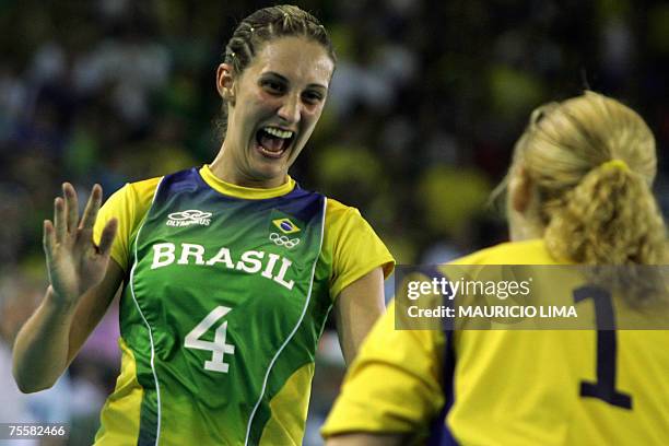 Rio de Janeiro, BRAZIL: Brazil's Fabiana Gripa celebrates her goal against Cuba with teammate goalkeeper Chana Masson during their Rio 2007 Pan...