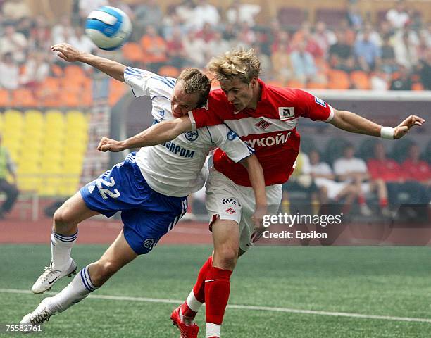 Roman Pavlyuchenko of FC Spartak Moscow competes for the ball with Aleksandr Anyukov of FC Zenit Saint Petersburg during the Russian Football League...