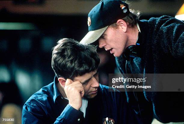 Director Ron Howard speaks with actor Russell Crowe on the set of the film "A Beautiful Mind."