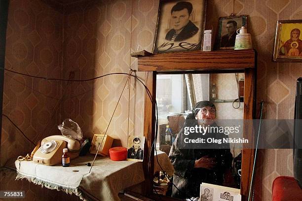 Eighty two year old refugee Babelina Kasviani sits alone in her room April 2, 2002 in the Hotel Iveriya in Tbilisi, Georgia. The hotel is home to...