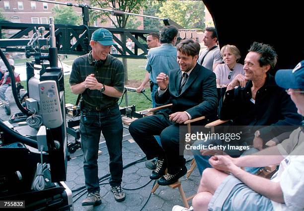 Director Ron Howard, actor Russell Crowe, producer Brian Grazer and writer Akiva Goldsmith talk on the set of the film "A Beautiful Mind."