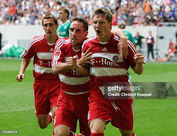 Bastian Schweinsteiger of Bayern celebrates his first goal with Franck Ribery during the Premiere Liga Cup match between Werder Bremen and Bayern...