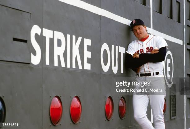 Roger Clemens of the Boston Red Sox poses against the scoreboard in May 1986 commemorating his 20 strike out game against the Seattle Mariners on...