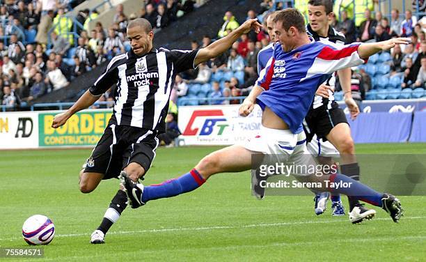 Newcastle United's Keiron Dyer is challenged by Carlisles Danny Livesey during a pre-season friendly between Carlisle United and Newcastle United at...