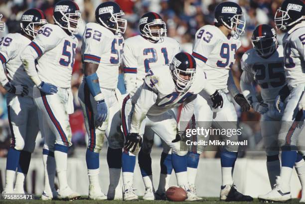 Erik Howard, Nose Tackle for the New York Giants prepares to snap the ball with his offensive line during the National Football Conference East game...