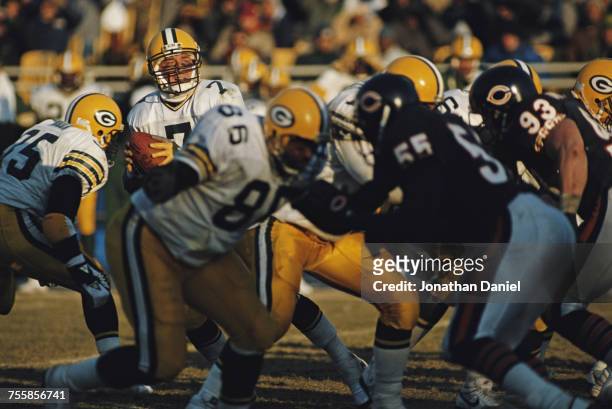 Don Majkowski, Quarterback for the Green Bay Packers takes the snap and prepares to throw during the National Football Conference Central game...