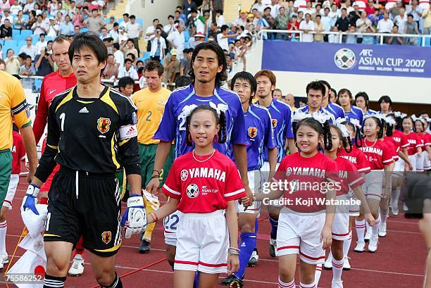 The Japanese team lines up for the start of the AFC Asian Cup 2007 Quarter Final between Japan and the Australian Socceroos at My Dinh National...