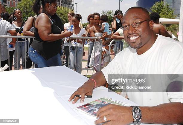Atlanta Falcon Alge Crumpler sign autographs at Centennial Olympic Park on July 21, 2007 in Atlanta Georgia as part of Dr. Ian Smith's "An Event to...