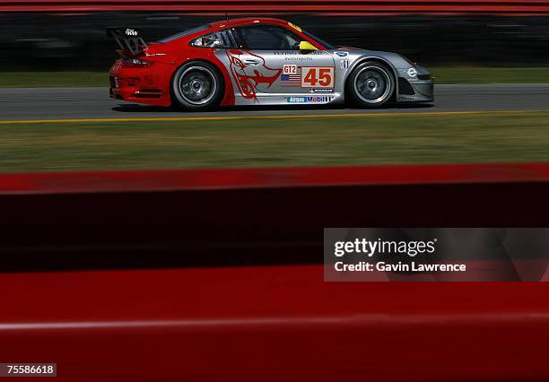 Johannes Van Overbeck and Jorg Bergmesiter driving the Flying Lizard Motorsports Porsche 911 GT3 RSR during the American Le Mans Series Acura Sports...