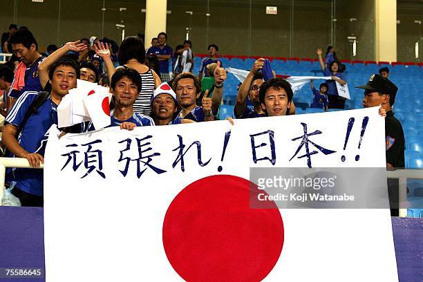Japanese supporters cheer after the AFC Asian Cup 2007 Quarter Final between Japan and the Australian Socceroos at My Dinh National Stadium July 21,...