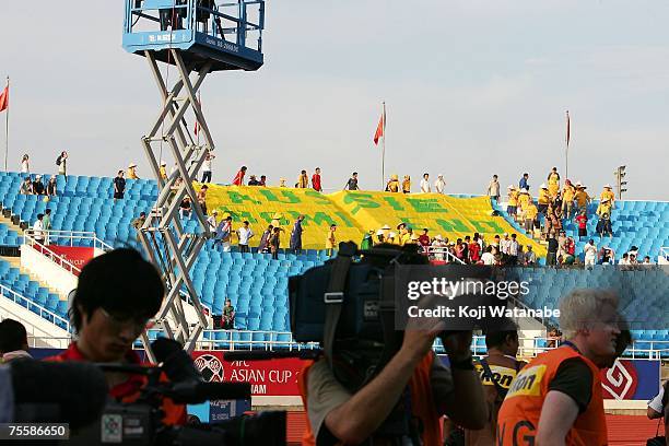 Australian supporters display a banner before the AFC Asian Cup 2007 Quarter Final between Japan and the Australian Socceroos at My Dinh National...