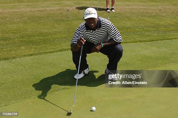 Bobby Jackson, of the New Orleans Hornets, lines up a putt during the Celebrity Golf Challenge at Cascata Golf Club part of his Second-Annual C....