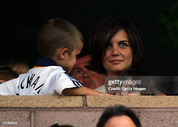 Cruz Beckham looks at Suri Cruise as Suri's mother, actress Katie Holmes, watches the Los Angeles Galaxy play Chelsea FC during the World Series of...