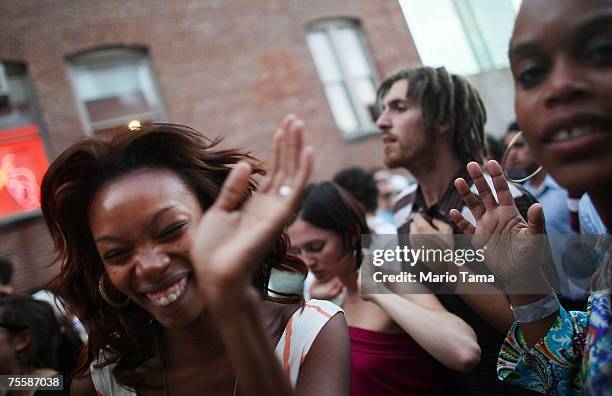 Shawna McBean and A.J. Miller dance at the P.S.1 Contemporary Art Center "Warm Up" party July 21, 2007 in the Queens borough of New York City. The...