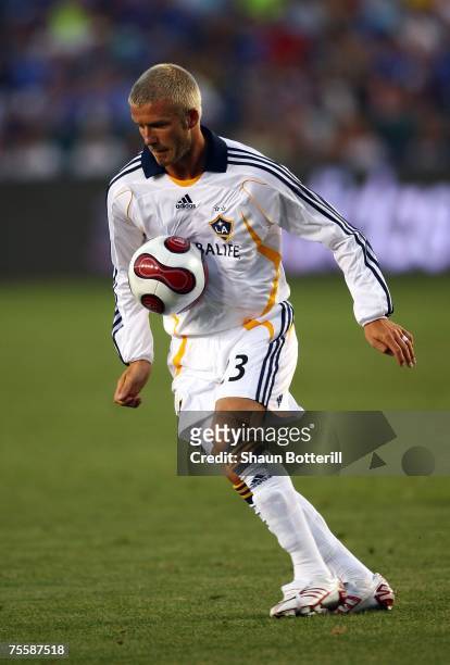 David Beckham of the Los Angeles Galaxy plays the ball off his chest at midfield iin the second half against Chelsea FC during the World Series of...