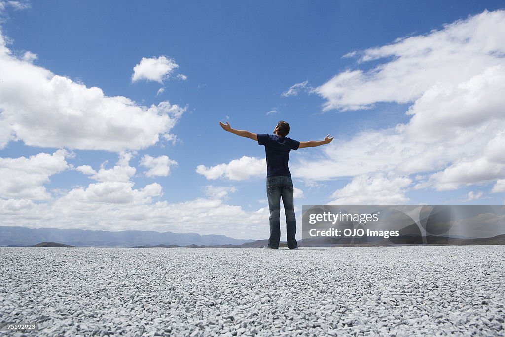 Man standing with outstretched arms