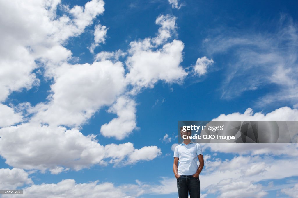 Man looking at the clouds and sky