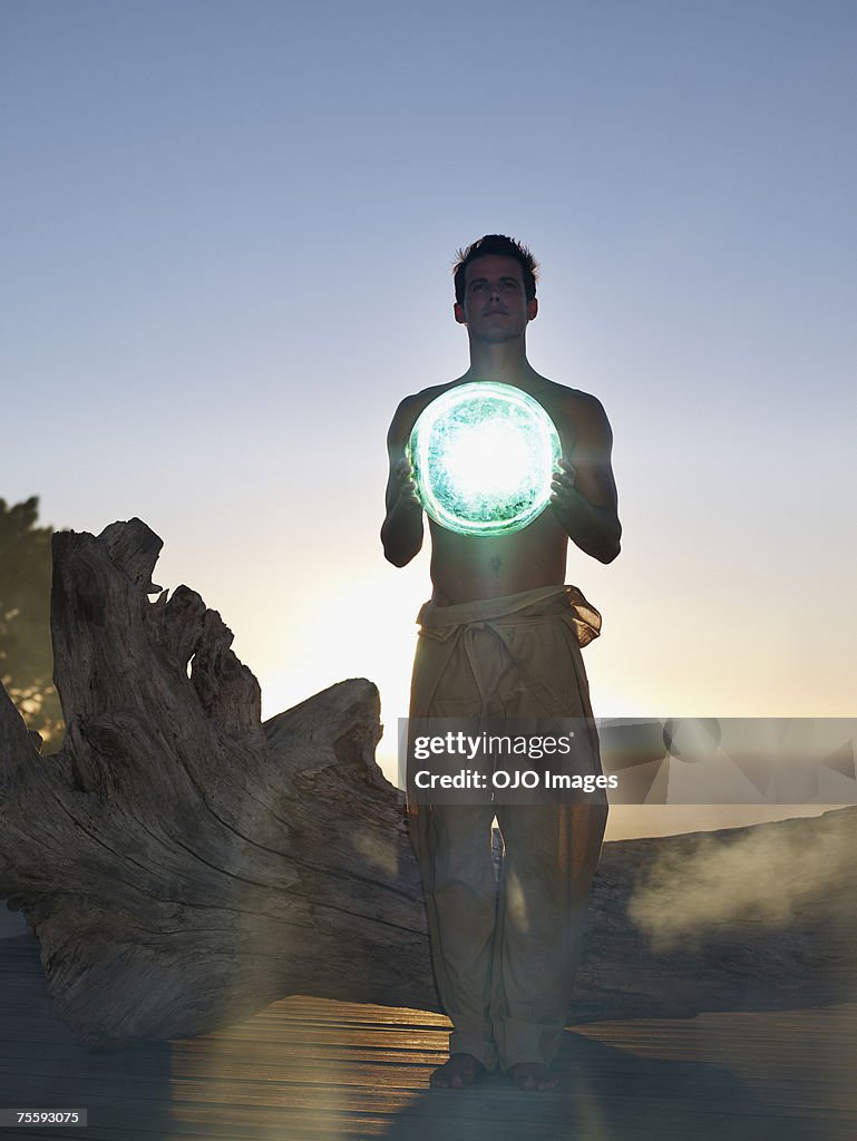 Man holding an orb
