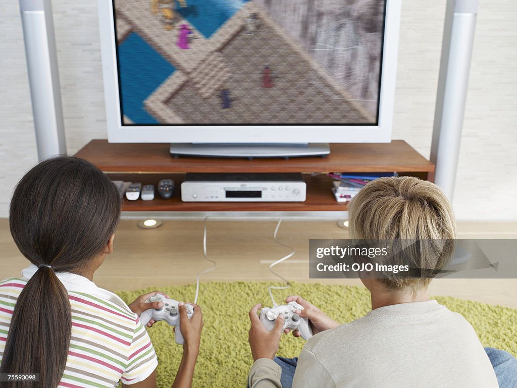 Two young kids playing video games