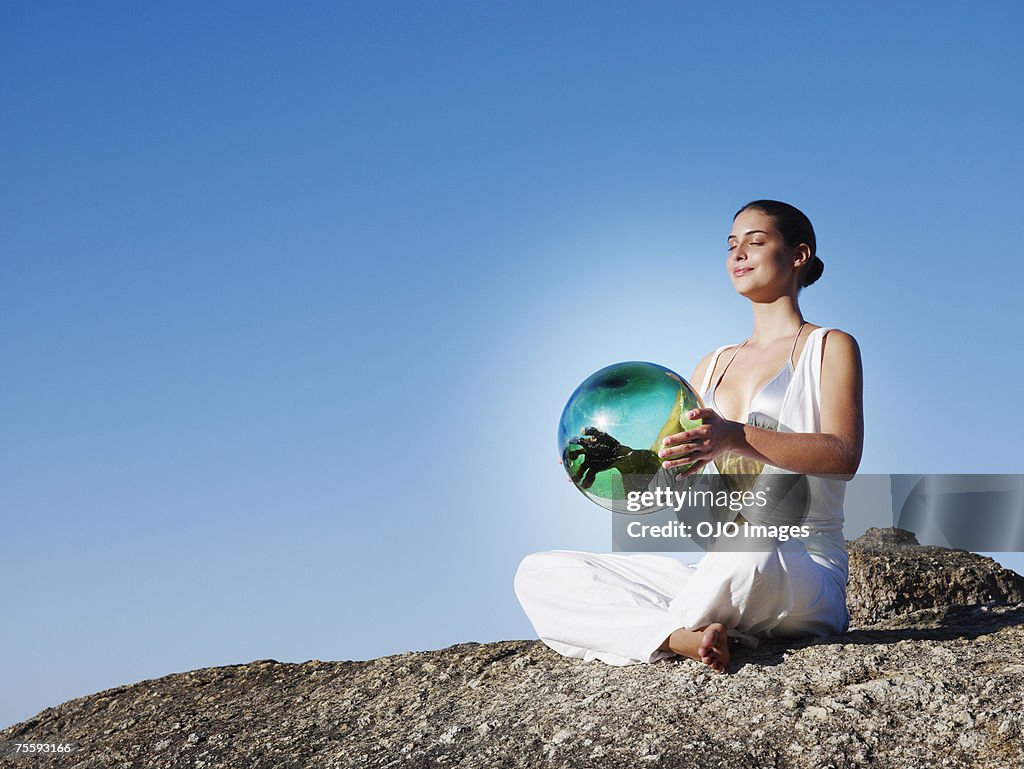 A woman holding an orb