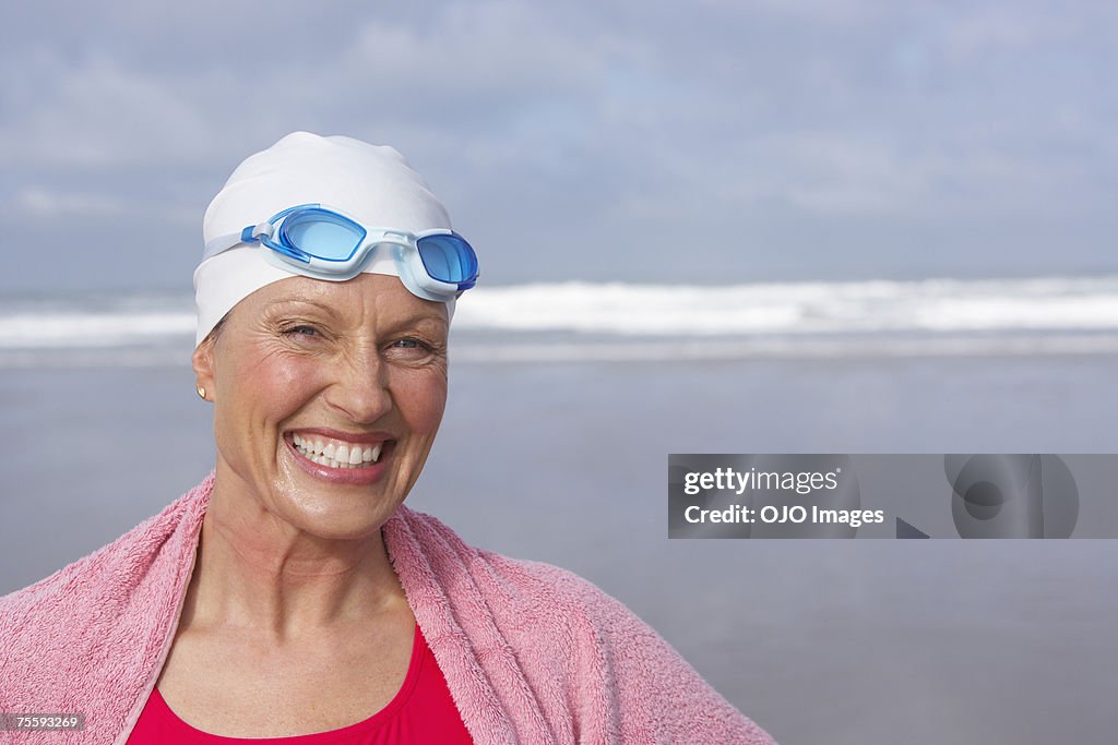 Woman at the beach wrapped in a towel