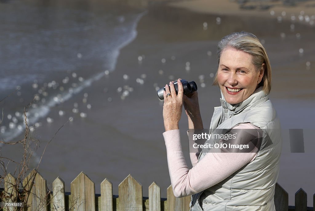 Senior woman holding binoculars