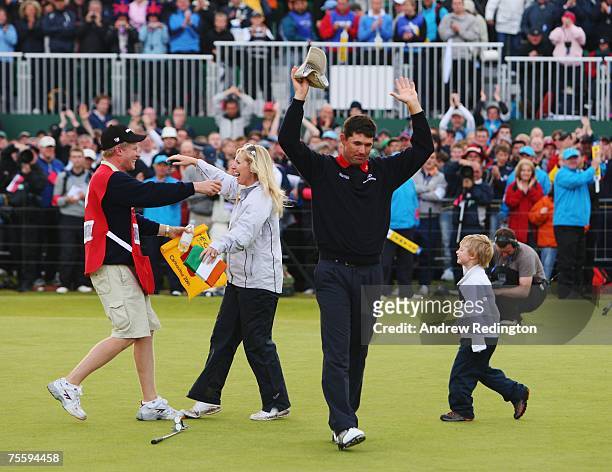 Padraig Harrington of Ireland celebrates with his wife Caroline, son Patrick and caddie Ronan Flood after defeating Sergio Garcia of Spain in the...
