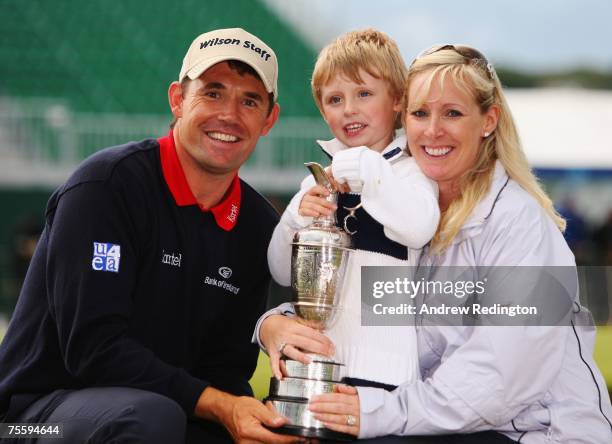 Padraig Harrington of Ireland celebrates with his wife Caroline and son Patrick and the Claret Jug after defeating Sergio Garcia of Spain in the...