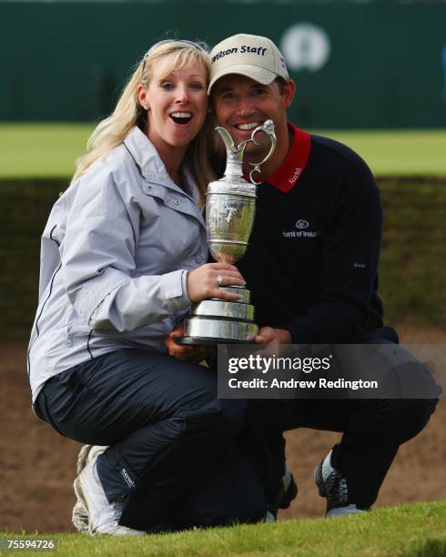 Padraig Harrington of Ireland celebrates with his wife Caroline and the Claret Jug after winning The 136th Open Championship at the Carnoustie Golf...