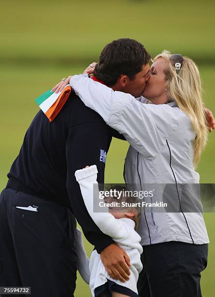 Padraig Harrington of Ireland celebrates with his wife Caroline and son Patrick after winning The 136th Open Championship at the Carnoustie Golf Club...