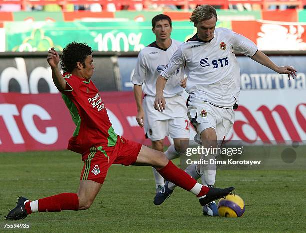 Rodolfo of FC Lokomotiv Moscow competes for the ball with Milos Krasic of PFC CSKA Moscow during the Russian Football League Championship match...