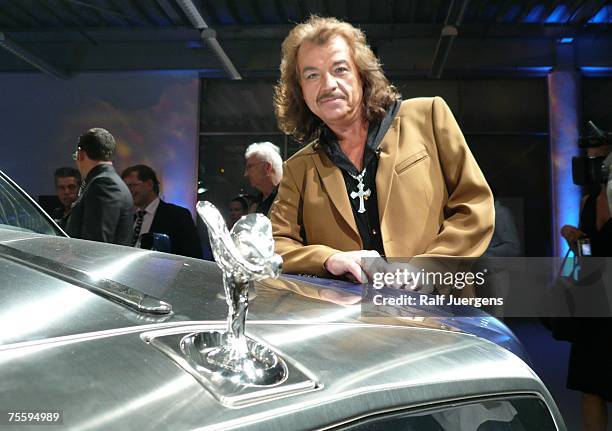 Alfredo Pauly poses behind the new Rolls Royce Cabrio at his unveiling at BMW Hammer in Cologne, Germany.