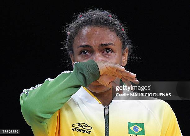 Rio de Janeiro, BRAZIL: Brazil's Erika Miranda cries during the award ceremony after losing against Cuba's Sheila Espinosa in the women Judo 52kg...