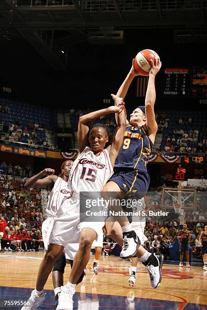 Evanthia Maltsi of the Connecticut Sun shoots over Crystal Smith of the Houston Comets at Mohegan Sun July 22, 2007 in Uncasville, Connecticut. NOTE...