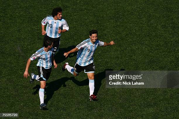 Mauro Zarate of Argentina celebrates scoring the winning goal with team mates Matias Sanchez and Lautaro Acosta against the Czech Republic during the...