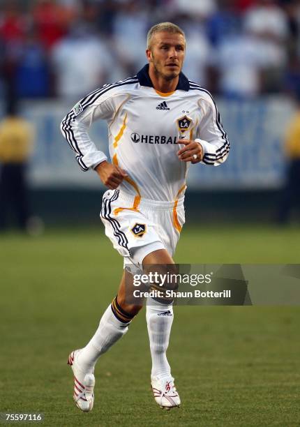 David Beckham of the Los Angeles Galaxy runs onto the field to play for the first time as a Galaxy iin the second half against Chelsea FC during the...