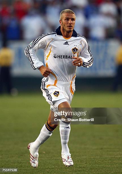 David Beckham of the Los Angeles Galaxy runs onto the field to play for the first time as a Galaxy iin the second half against Chelsea FC during the...