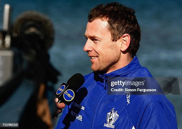 Adam Simpson of the Kangaroos is interviewed by the media during the Kangaroos AFL recovery session at St Kilda Sea Baths on July 23, 2007 in...