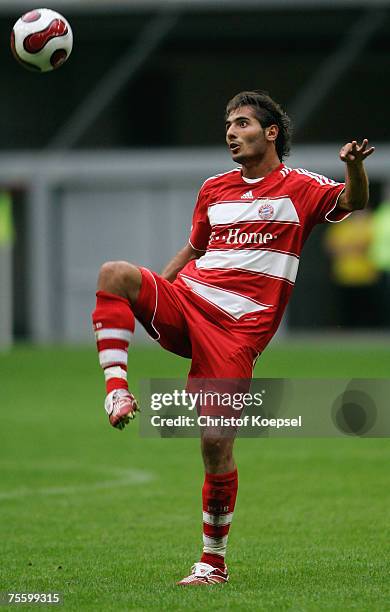 Hamit Altintop of Bayern juggles with the ball during the Premiere Liga Cup match between Werder Bremen and Bayern Munich at the LTU Arena on July...