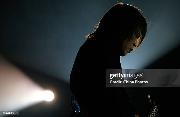 Taiwanese singer Wu Pai performs at the first "Green Flag - Erdos Grassland Rock Music Festival" near the Mausoleum of Genghis Khan on July 20, 2007...