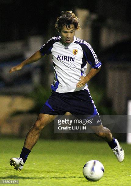 Japanese forward Naohiro Takahara kicks a ball during a team training session in Hanoi, 23 July 2007. Japan defeated Australia in the quarter-final...