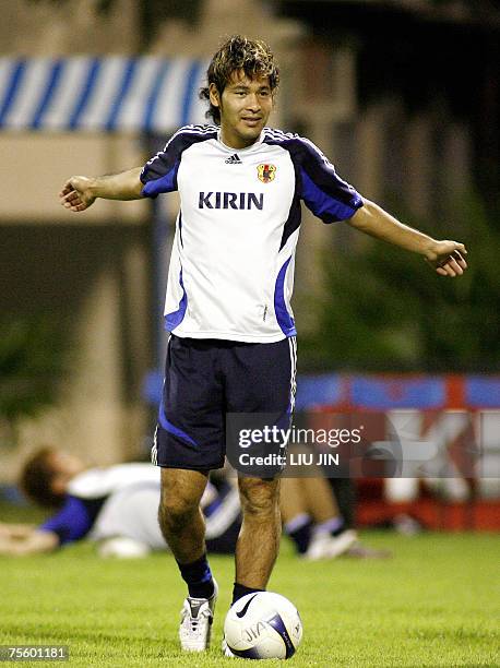 Japanese forward Naohiro Takahara warms up during a team training session in Hanoi, 23 July 2007. Japan defeated Australia in the quarter-final to...