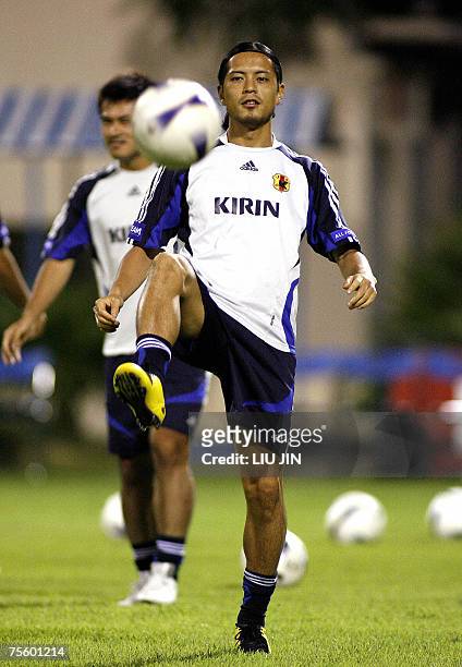 Japanese midfielder Keita Suzuki warms up during a team training session in Hanoi, 23 July 2007. Japan defeated Australia in the quarter-final to...