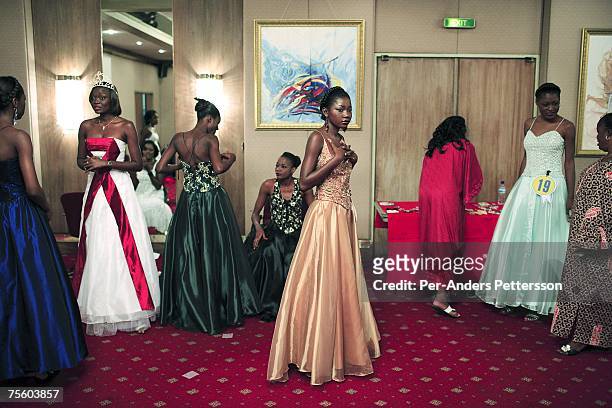 Unidentified contestants in the Miss Congo contest prepare backstage to enter the stage on April 21, 2006 in central Kinshasa, Congo, DRC. About...